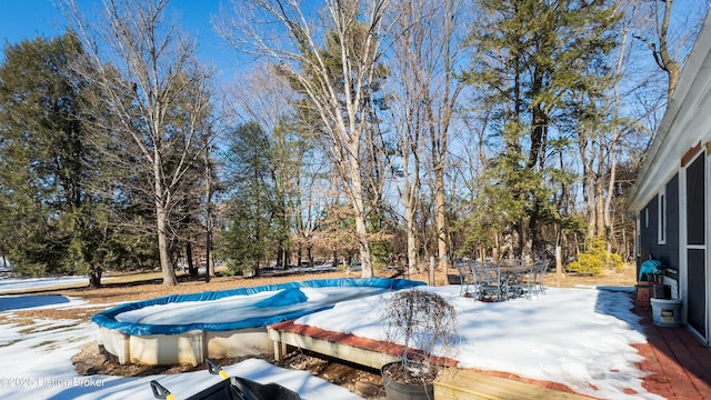 view of snow covered pool