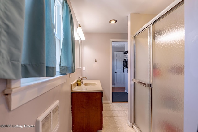 bathroom with vanity and an enclosed shower