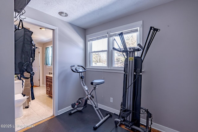 exercise area with a textured ceiling