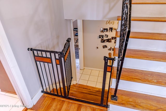 stairs featuring wood-type flooring