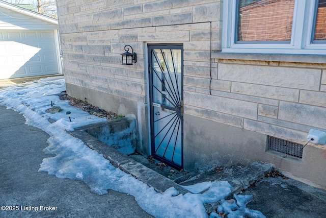 entrance to property featuring a garage