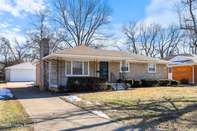 single story home featuring a garage, an outdoor structure, and a front lawn