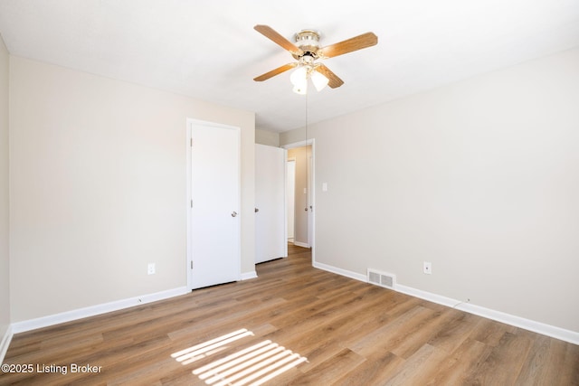 spare room with ceiling fan and light hardwood / wood-style floors