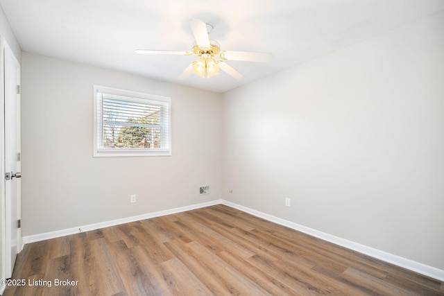 empty room featuring hardwood / wood-style floors and ceiling fan