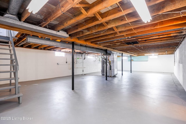 basement with plenty of natural light and heating unit