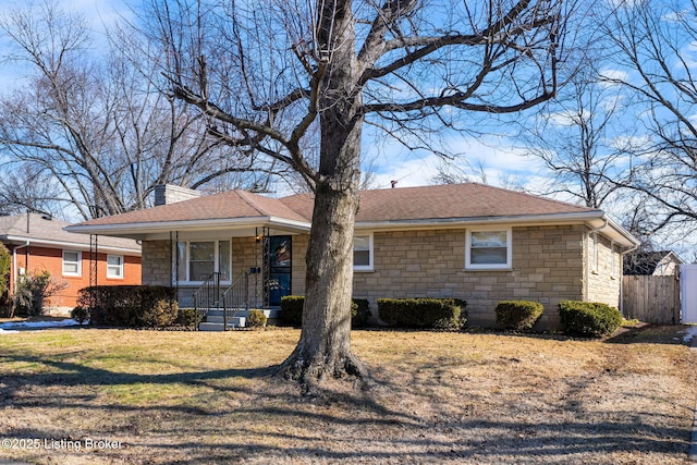 single story home featuring a porch and a front lawn