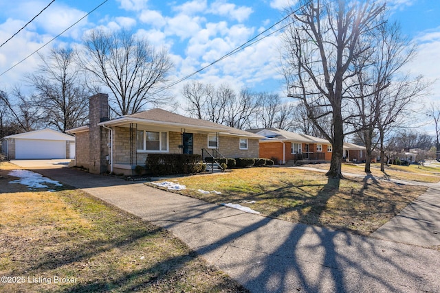 ranch-style house with a garage, an outdoor structure, a front lawn, and covered porch