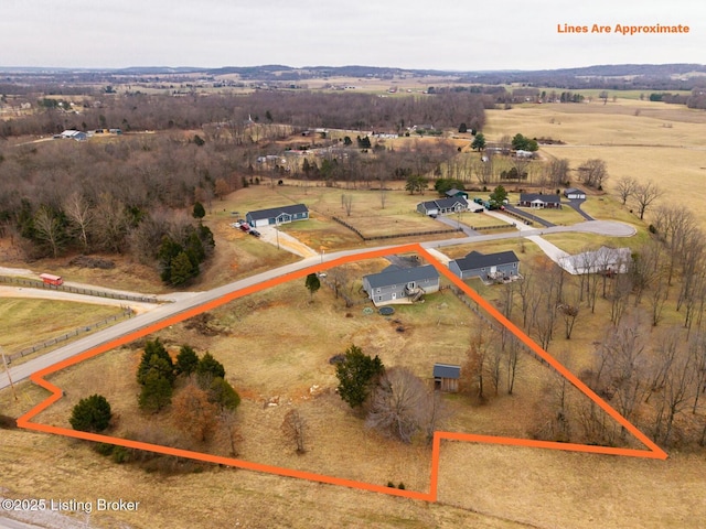 birds eye view of property featuring a rural view