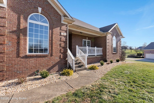 view of front facade with covered porch and a front yard