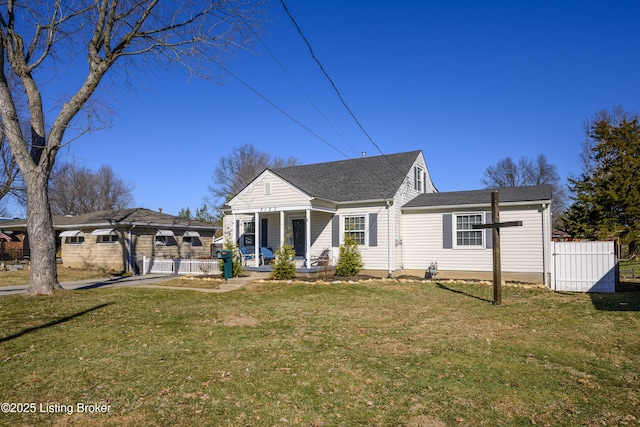 view of front facade with covered porch and a front lawn