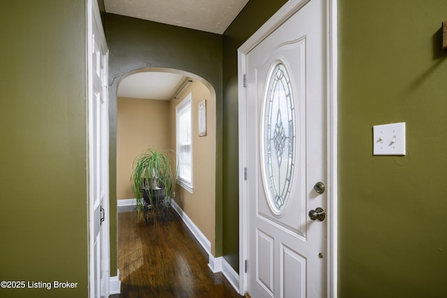 foyer entrance with dark hardwood / wood-style flooring