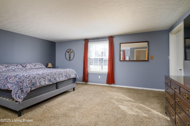 bedroom with carpet and a textured ceiling