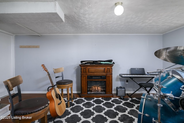 home office with hardwood / wood-style floors and a textured ceiling