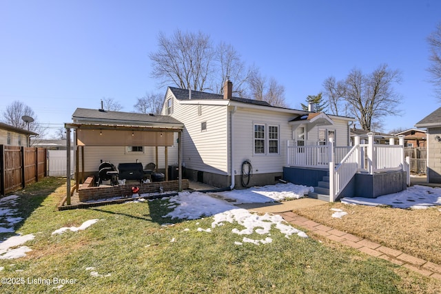 back of property featuring a lawn