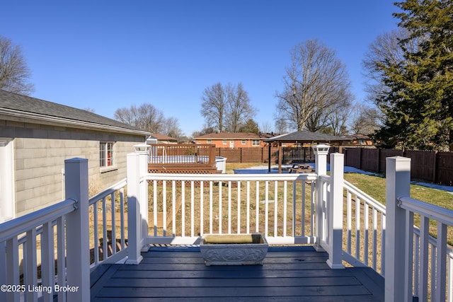 deck featuring a gazebo and a lawn