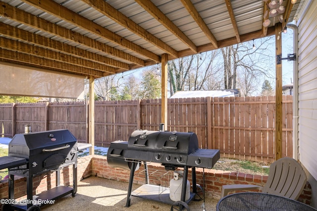 view of patio featuring a grill