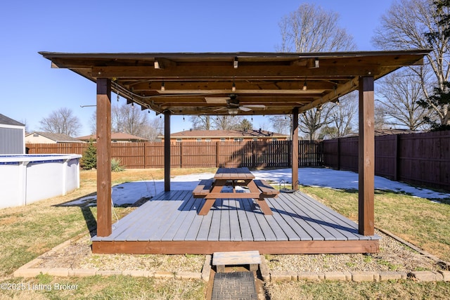 view of patio / terrace featuring a pool side deck and ceiling fan