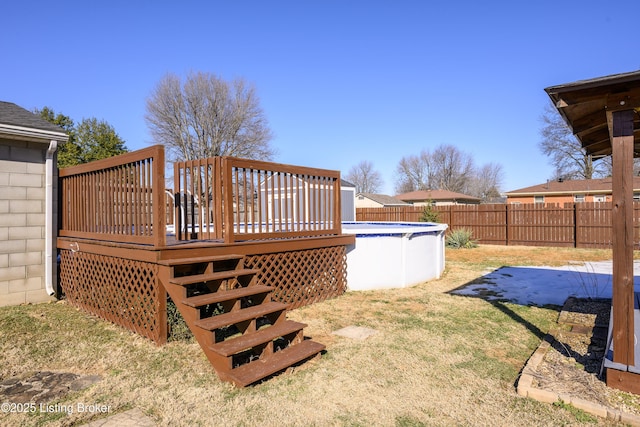 view of yard with a swimming pool side deck