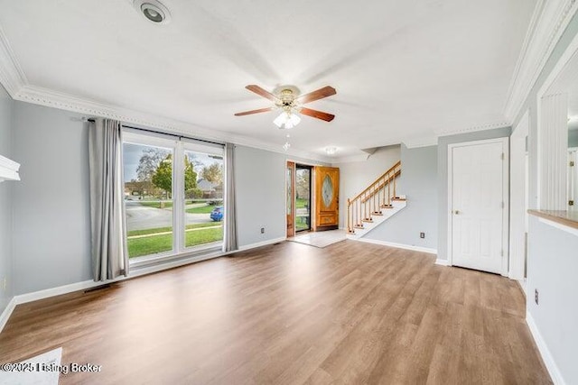 unfurnished living room featuring ornamental molding, light hardwood / wood-style floors, and a wealth of natural light