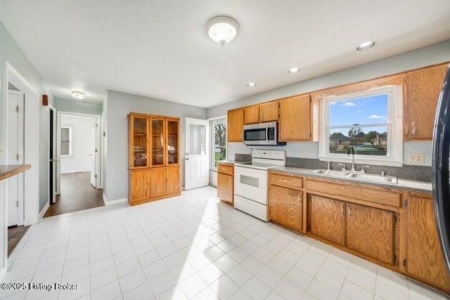 kitchen featuring sink and electric range