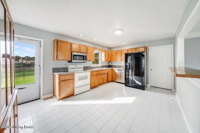 kitchen with appliances with stainless steel finishes and sink