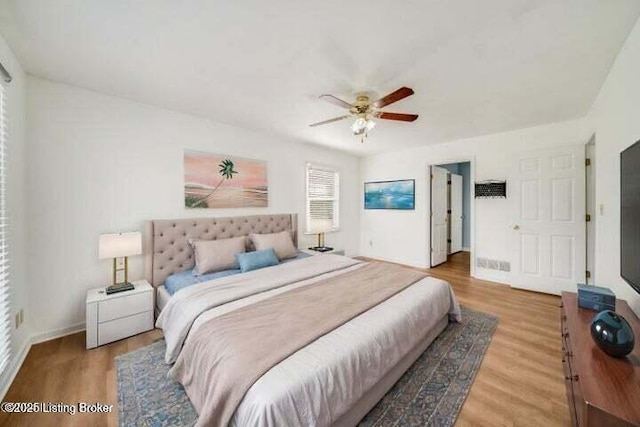 bedroom with wood-type flooring and ceiling fan