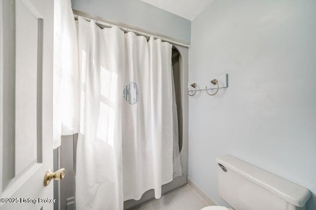 bathroom with tile patterned floors and toilet