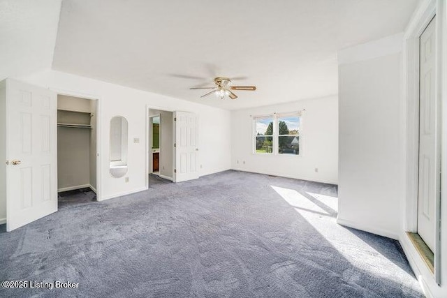 unfurnished bedroom with ceiling fan and carpet floors