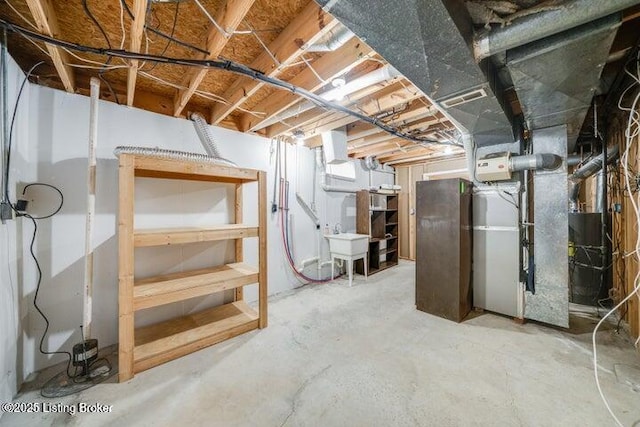 basement with sink and heating unit