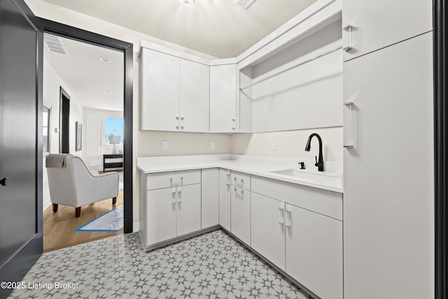 kitchen with sink and white cabinets