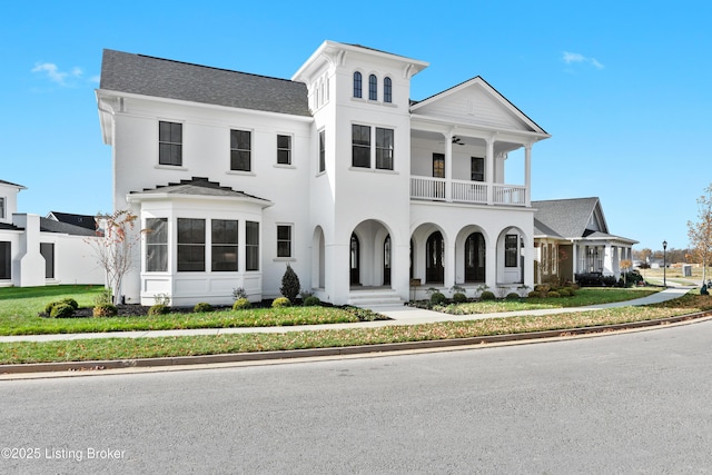 view of front of house featuring a balcony