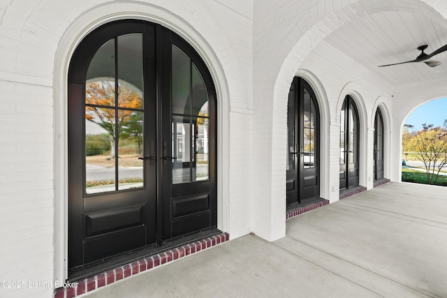 entrance to property featuring ceiling fan and french doors