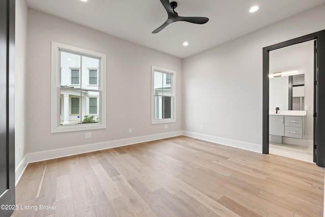 unfurnished bedroom featuring multiple windows, light hardwood / wood-style flooring, and ceiling fan