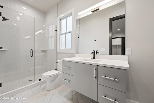 bathroom with vanity, walk in shower, and toilet