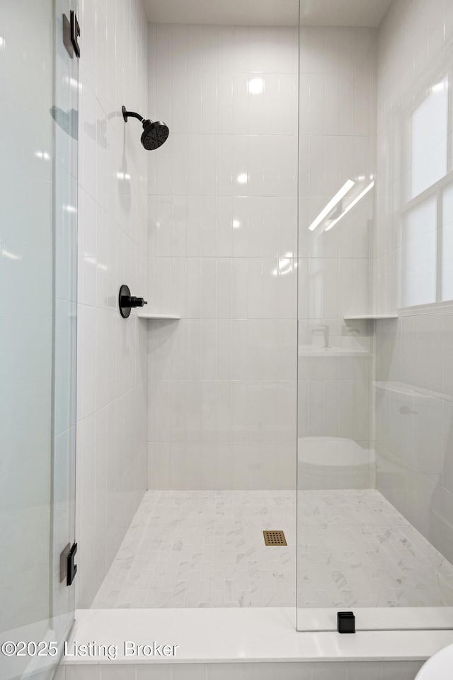 bathroom featuring an enclosed shower