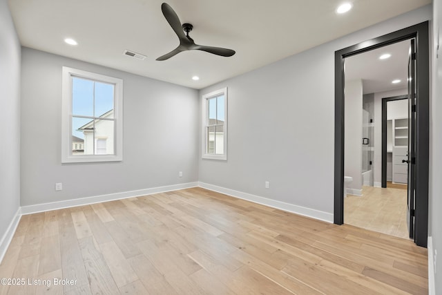 empty room with light hardwood / wood-style flooring and ceiling fan