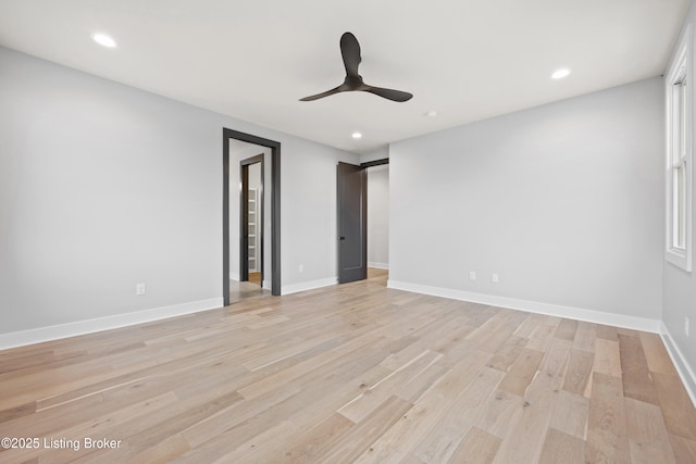 unfurnished bedroom with ceiling fan and light wood-type flooring