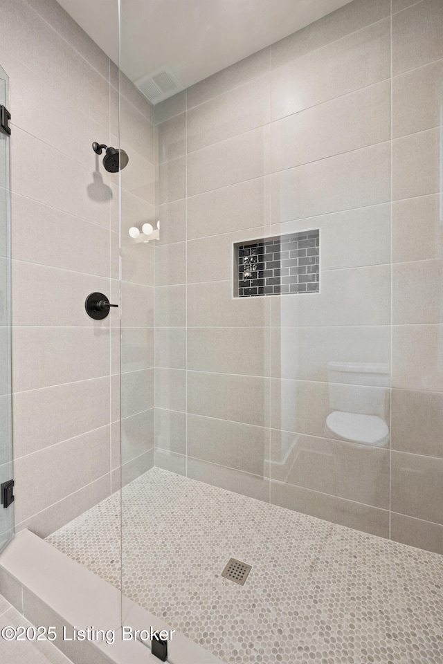 bathroom featuring an enclosed shower