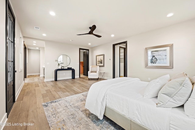 bedroom with light wood-type flooring and ceiling fan