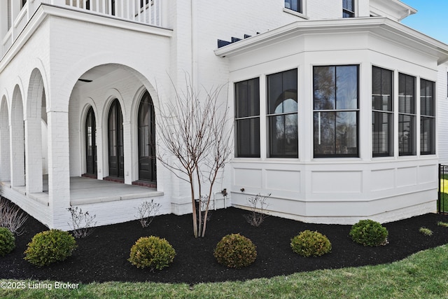 view of side of property featuring brick siding