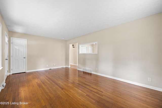 spare room featuring hardwood / wood-style floors