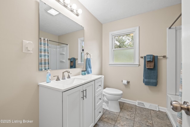 full bathroom featuring vanity, shower / tub combo, a textured ceiling, and toilet