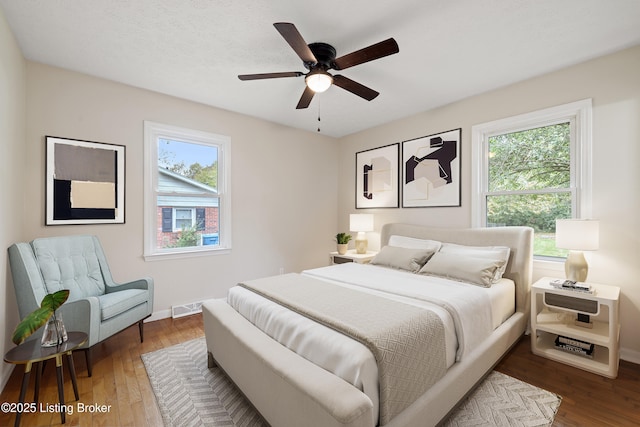 bedroom featuring dark wood-type flooring and ceiling fan