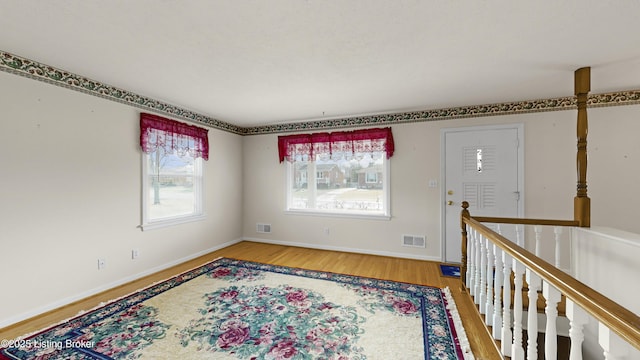 entrance foyer featuring hardwood / wood-style floors