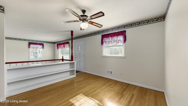 spare room featuring ceiling fan and wood-type flooring