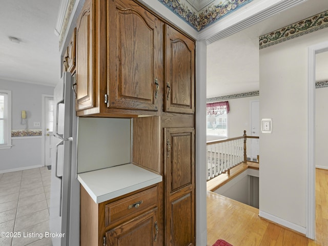 kitchen featuring white refrigerator and light tile patterned floors