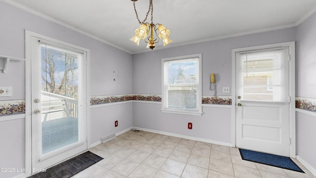 entryway with crown molding, light tile patterned floors, and a chandelier