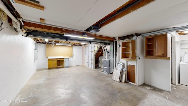 basement featuring washer / dryer and electric panel