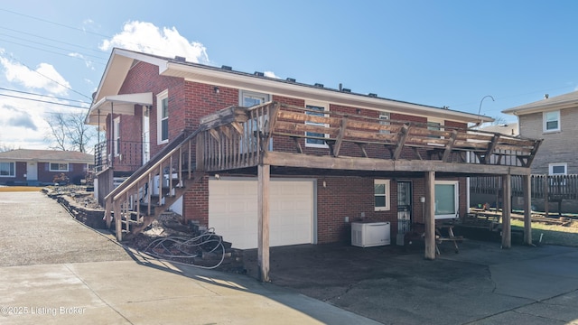 back of property featuring a garage