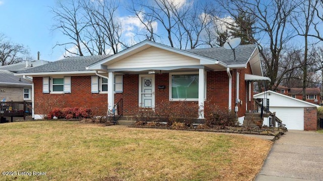 bungalow-style home featuring an outbuilding, a garage, and a front lawn